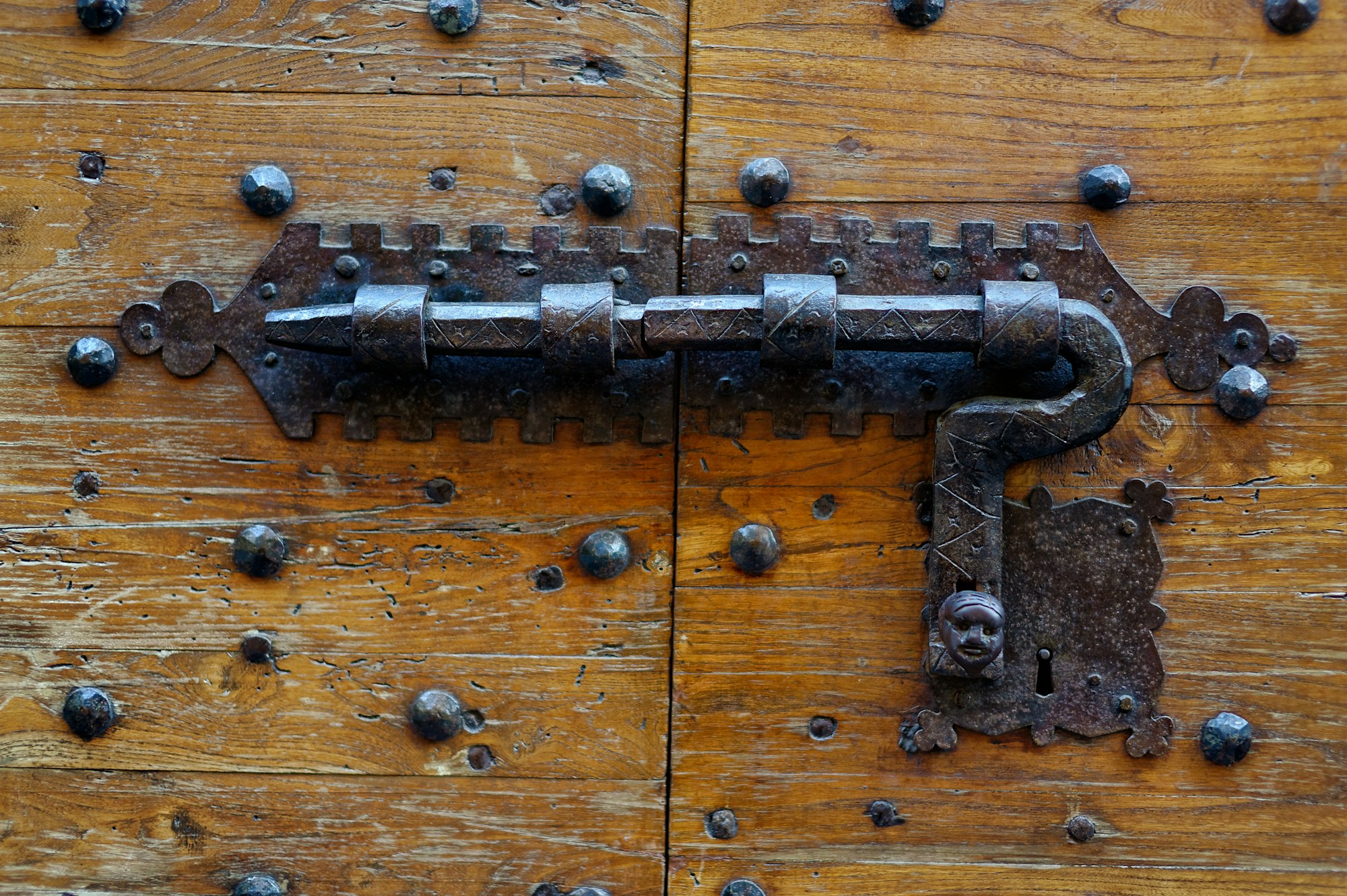 Ancient door with forged metal lock